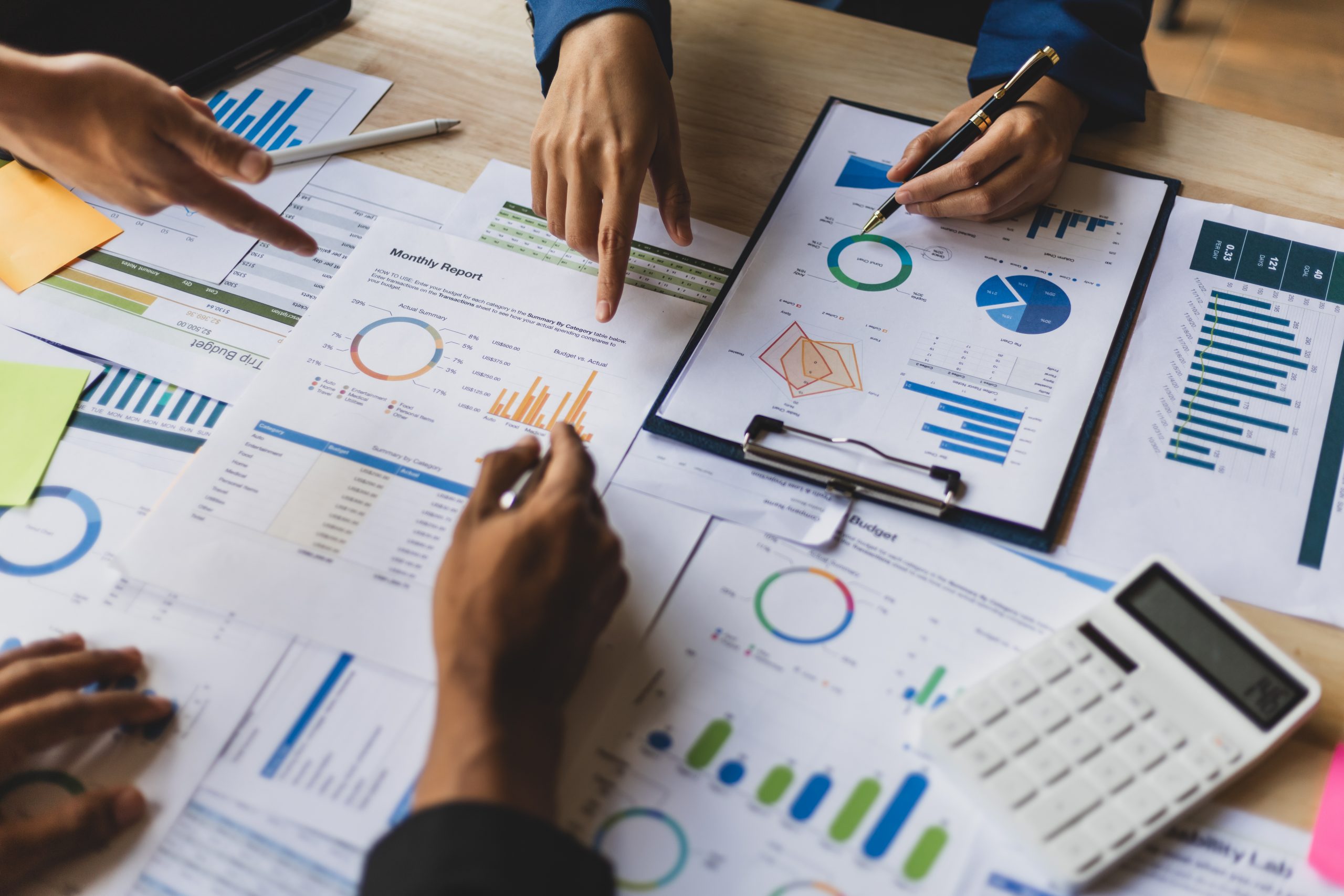 Business meeting, Financial consultants discuss investment growth chart analysis in company financial reports and are planning marketing business strategies.